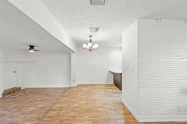 a view of a livingroom with wooden floor