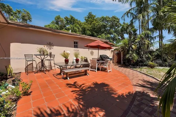 a view of a patio with swimming pool