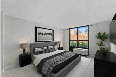 a bedroom with a large bed and a large window