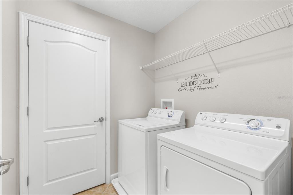 1762 Hadden Hall Place Trinity, FL 34655 - Photo 33 of 49 a utility room with dryer and washer