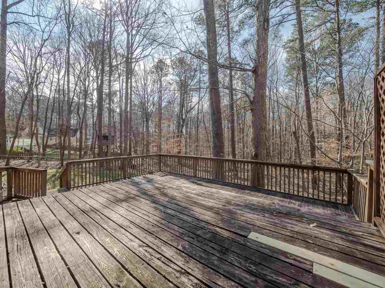 8317 Druids Lane Raleigh, NC 27613 - Photo 19 of 24 Large back deck overlooks fenced backyard and natural woods area. Back Deck