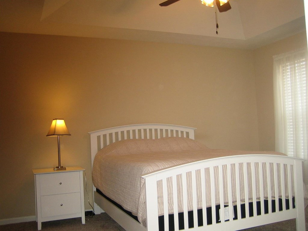 112 Kousa Lane Aiken, SC 29803 - Photo 4 of 17 a bedroom with a bed and a table