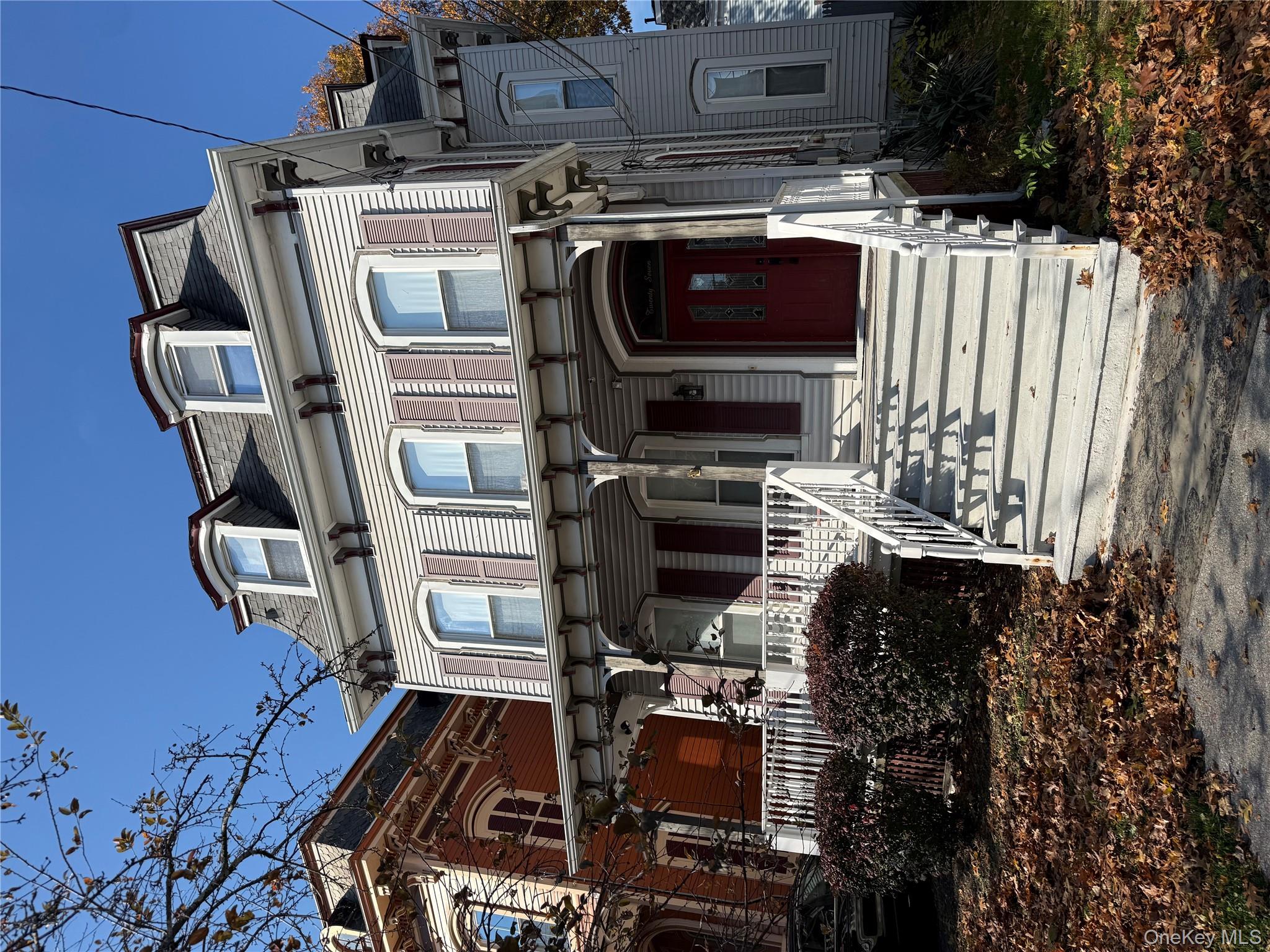 27 Balding Avenue, Unit 1 Poughkeepsie, NY 12601 - Photo 1 of 16 a front view of a house with a yard