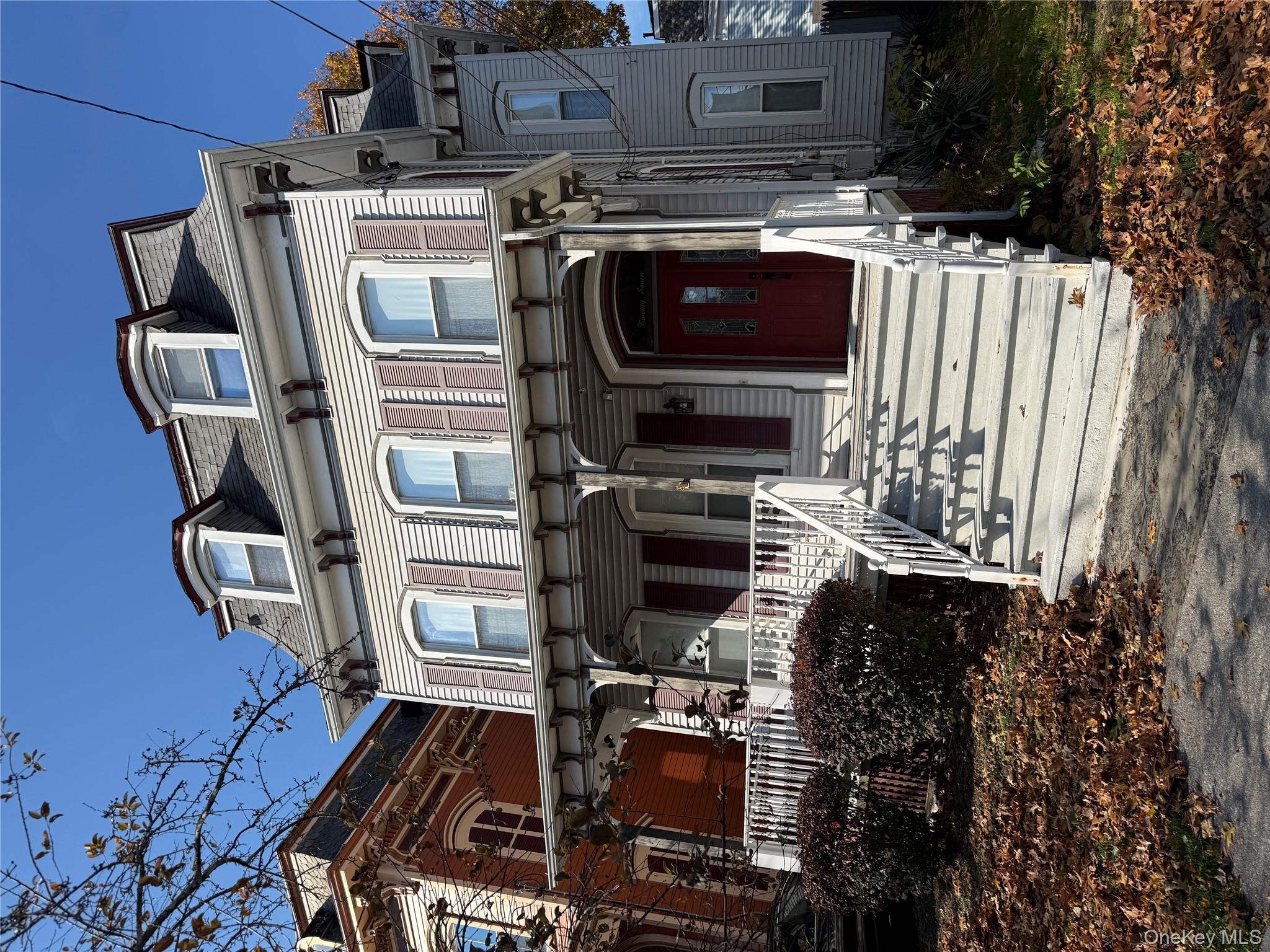 27 Balding Avenue, Unit 1 Poughkeepsie, NY 12601 - Photo 2 of 16 a front view of a house with a yard