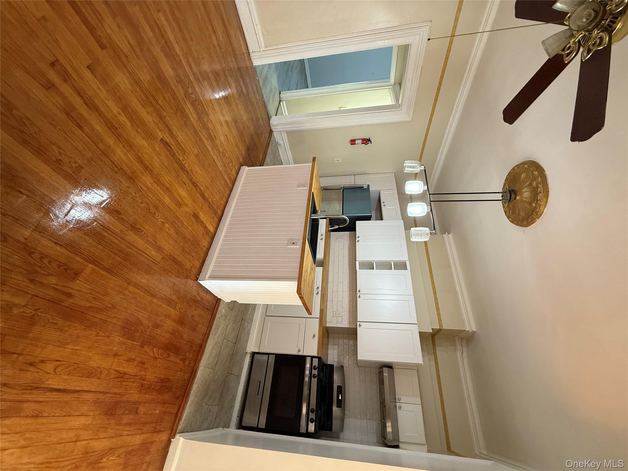 27 Balding Avenue, Unit 1 Poughkeepsie, NY 12601 - Photo 5 of 16 a kitchen with stainless steel appliances granite countertop a sink and cabinets