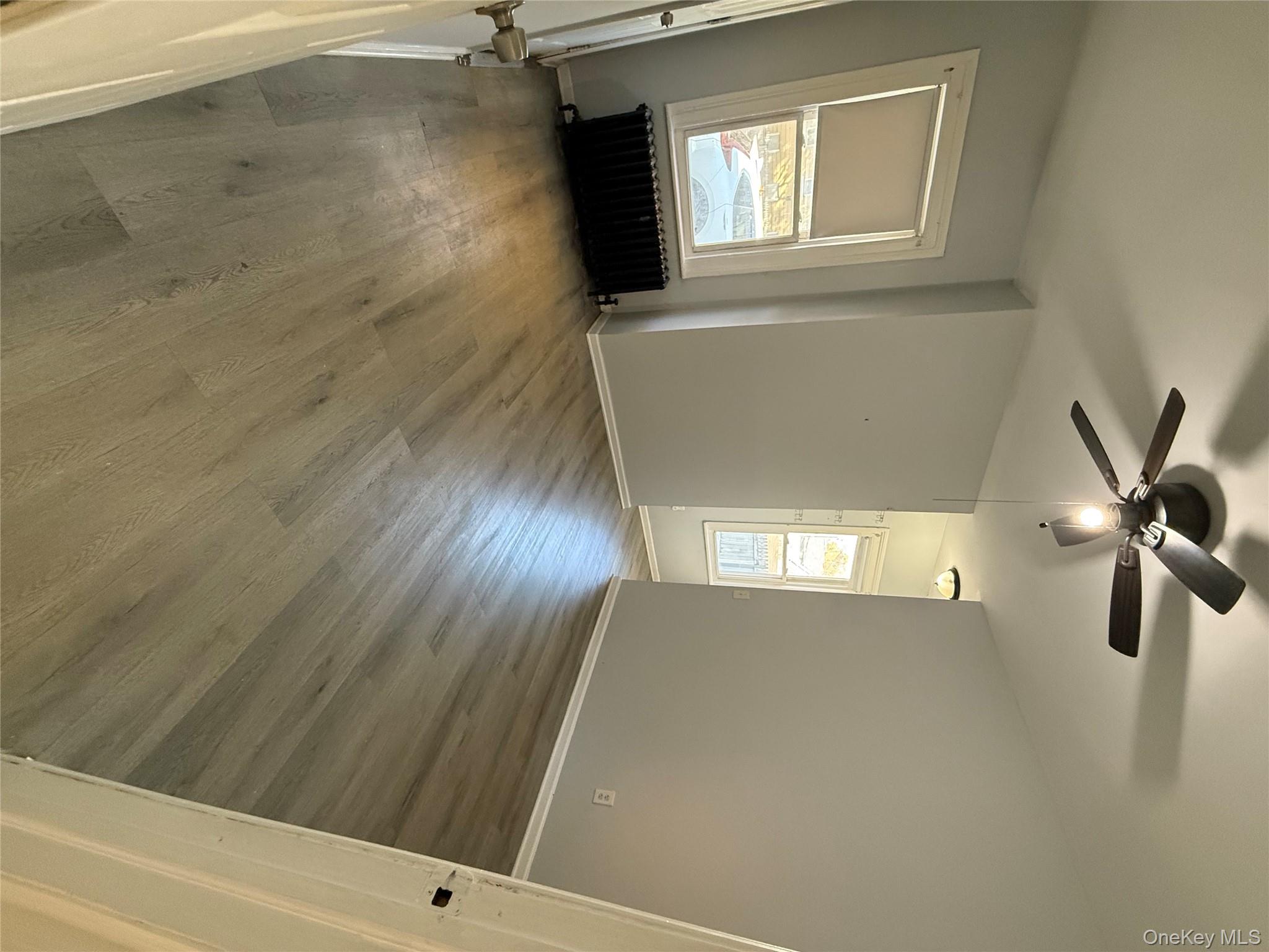 27 Balding Avenue, Unit 1 Poughkeepsie, NY 12601 - Photo 9 of 16 wooden floor in an empty room with a window