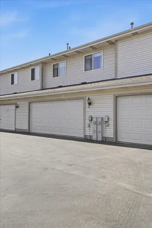 a front view of a house with garage