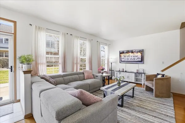 a living room with furniture and a large window