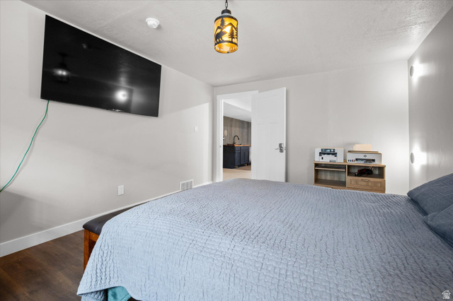 3359 Eurasian Crane Road Clinton, UT 84015 - Photo 47 of 71 Bedroom featuring dark wood-style floors and ensuite bathroom