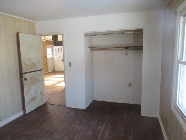 28448 West Big Hollow Road Ingleside, IL 60041 - Photo 15 of 28 a view of empty room with wooden floor and fan