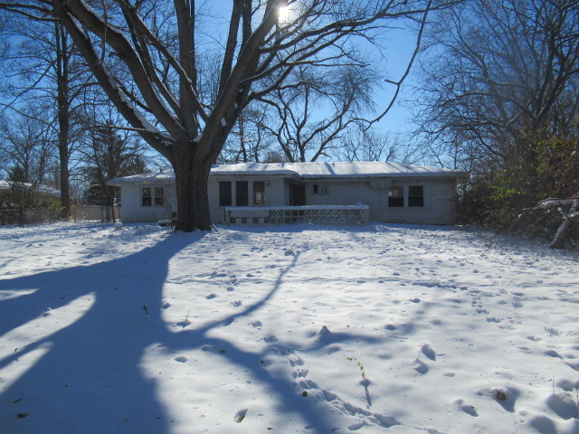 28448 West Big Hollow Road Ingleside, IL 60041 - Photo 24 of 28 a backyard of a house with large tree and wooden fence