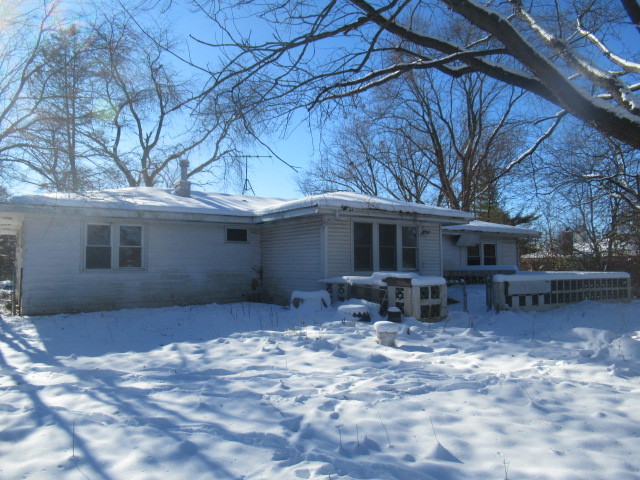 28448 West Big Hollow Road Ingleside, IL 60041 - Photo 25 of 28 a view of a house with a yard covered in snow