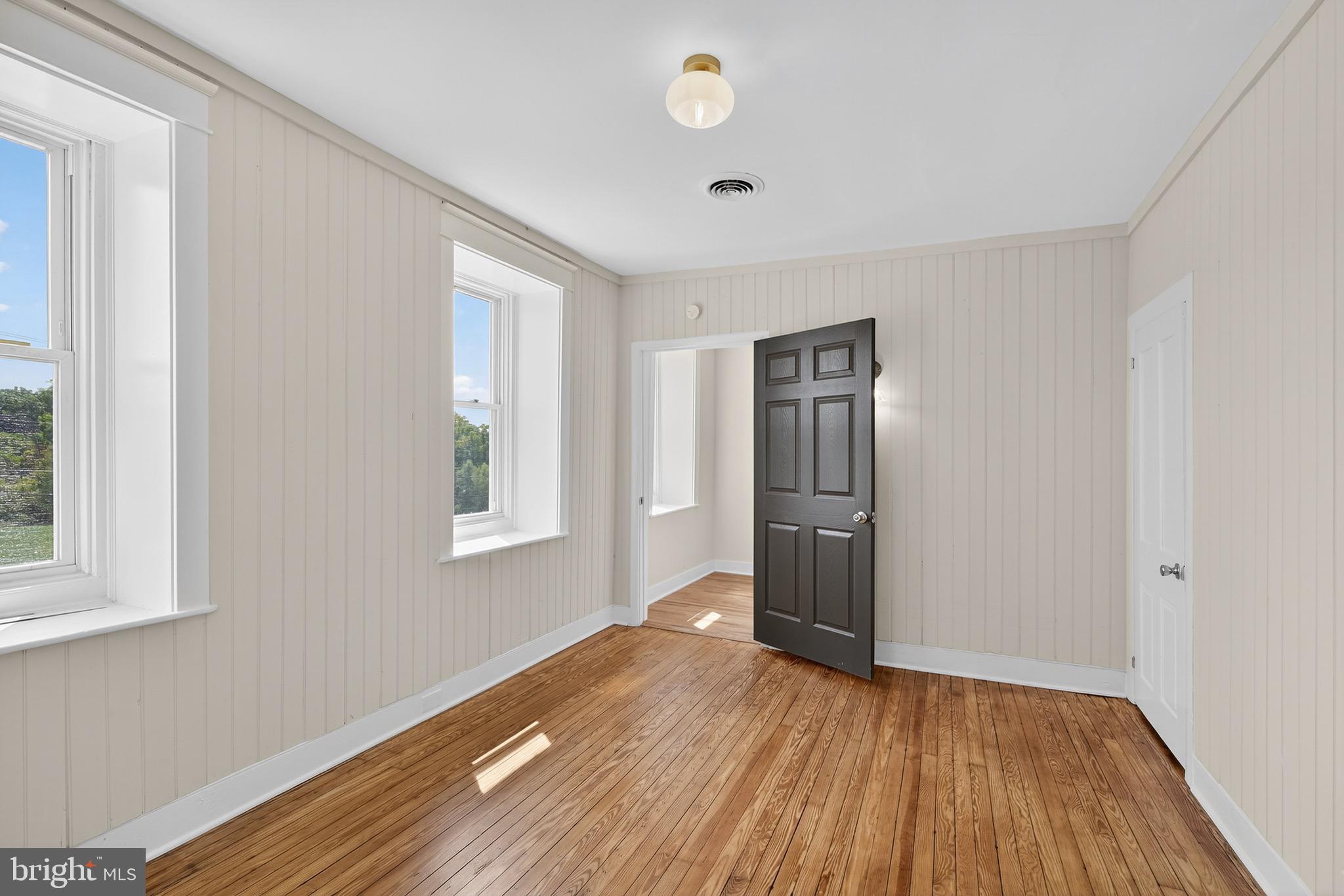 225 East Canal Road York, PA 17404 - Photo 36 of 81 a view of an empty room with wooden floor and a window