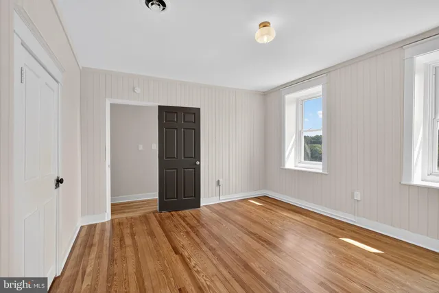 a view of an empty room with stairs