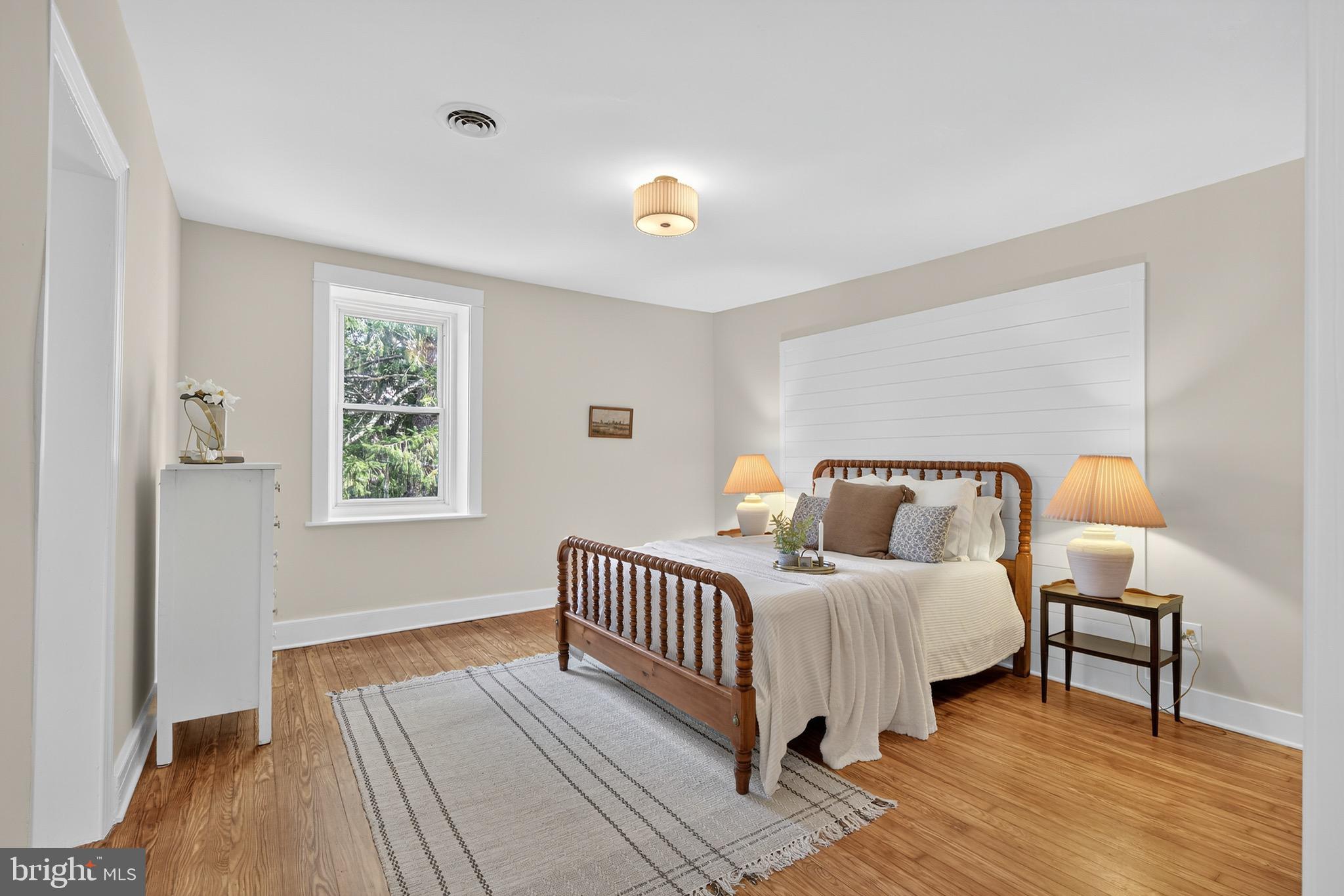 225 East Canal Road York, PA 17404 - Photo 42 of 81 a bedroom with a bed wooden floor and a window