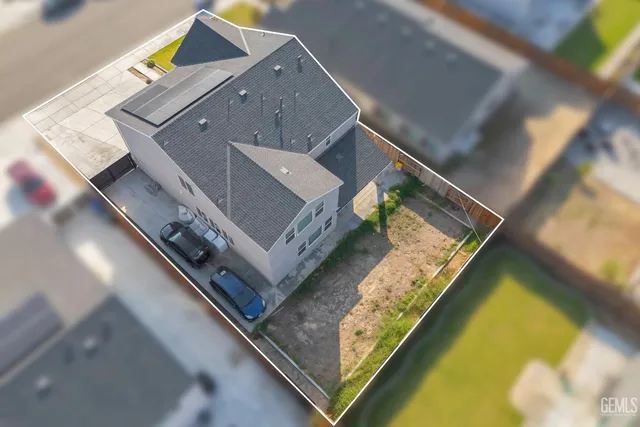an aerial view of residential building and parking space