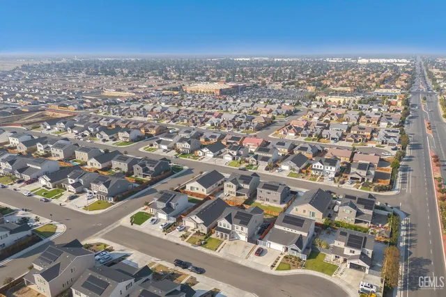 an aerial view of a city with ocean