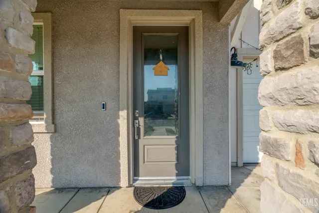 a bathroom with a glass door shower