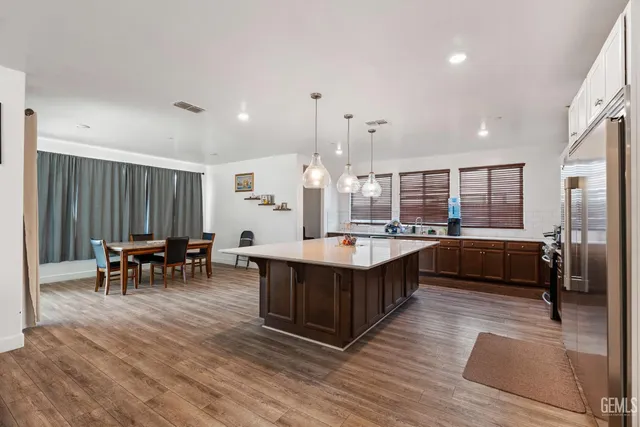 a large kitchen with lots of table and chairs