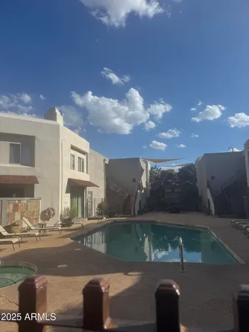 a view of a street with a building in the background