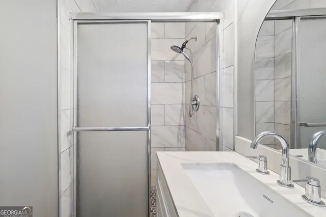 a bathroom with a sink and a shower