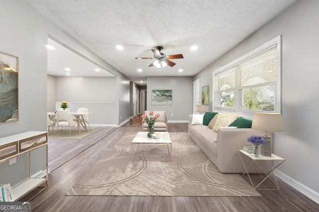 a living room with furniture and a large window