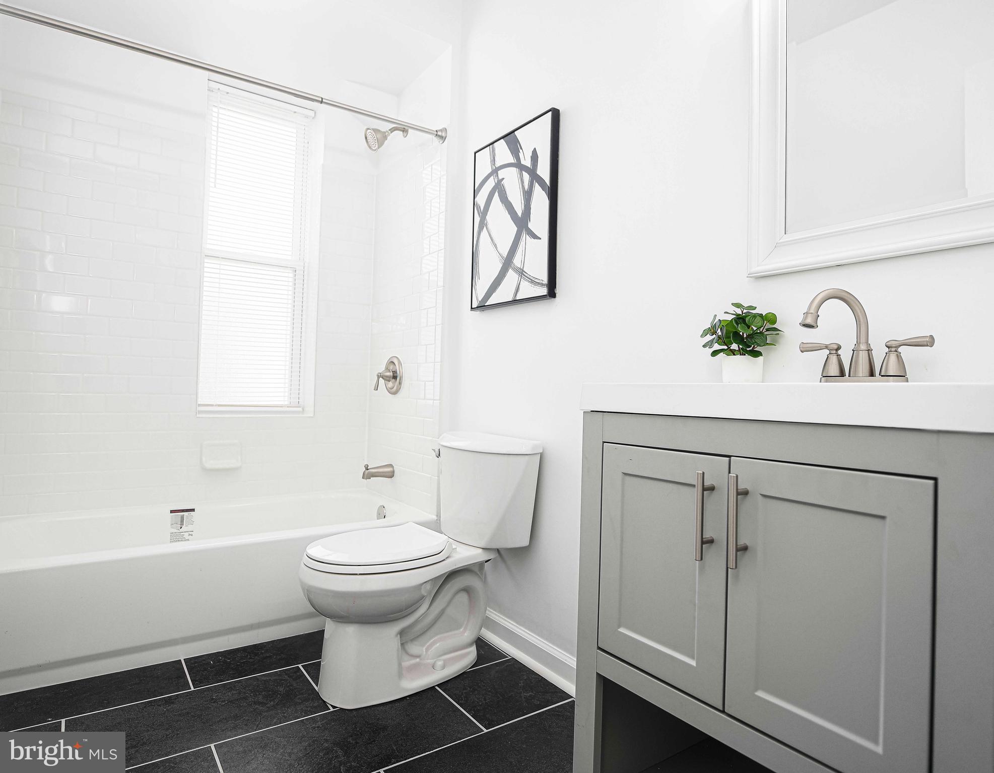 535 North Decker Avenue Baltimore, MD 21205 - Photo 14 of 24 a bathroom with a sink toilet and shower