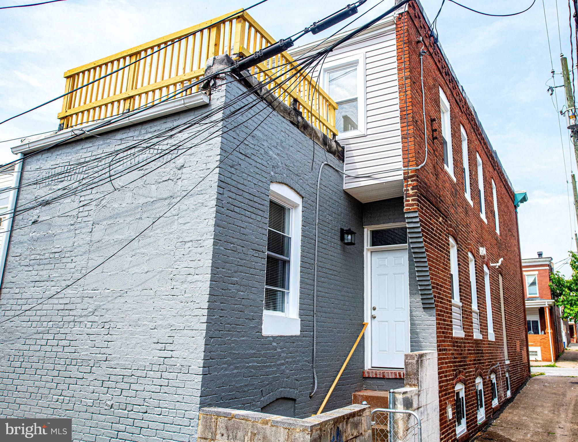 535 North Decker Avenue Baltimore, MD 21205 - Photo 23 of 24 a view of a house with a wooden deck