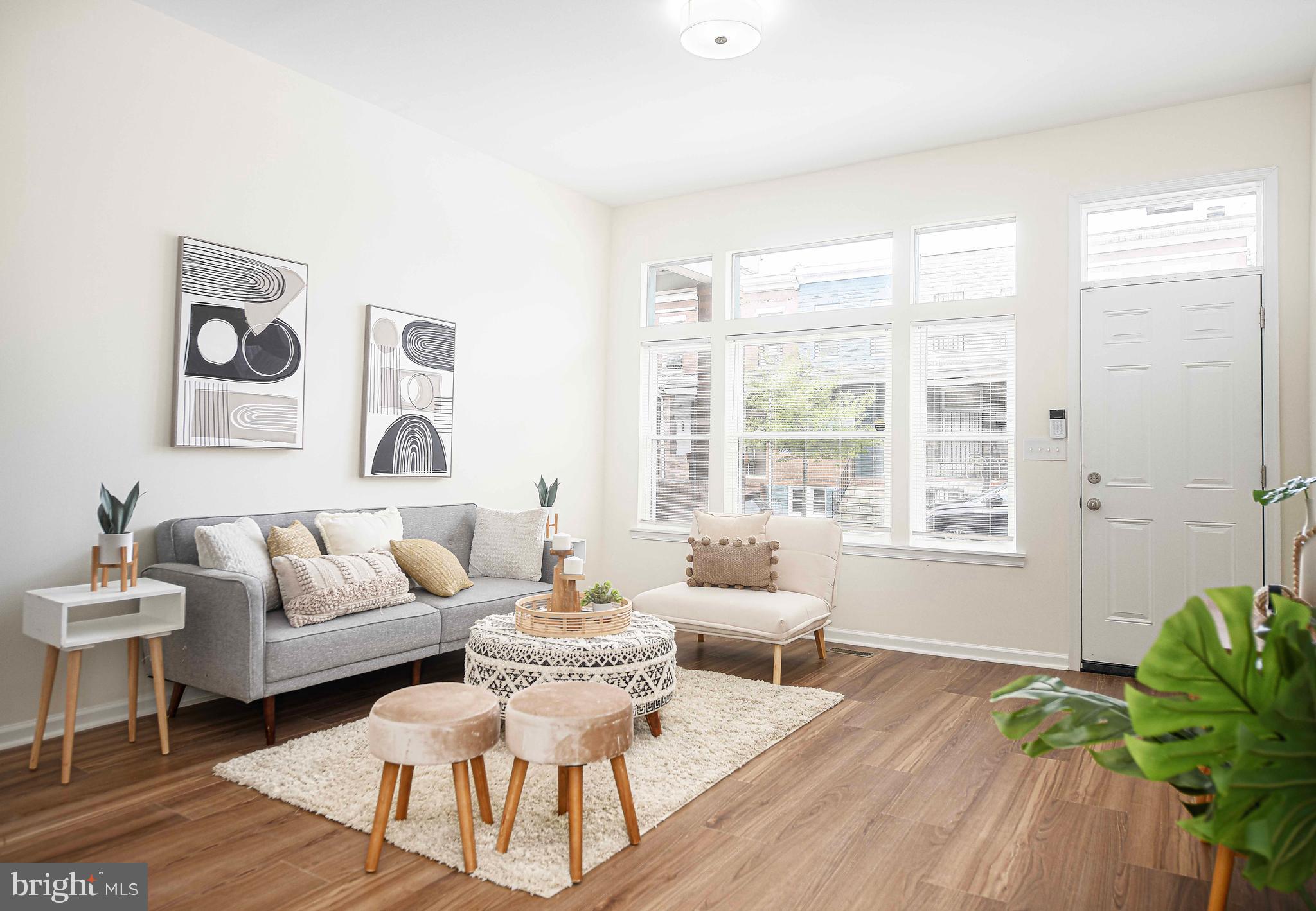 535 North Decker Avenue Baltimore, MD 21205 - Photo 4 of 24 a living room with furniture and a large window