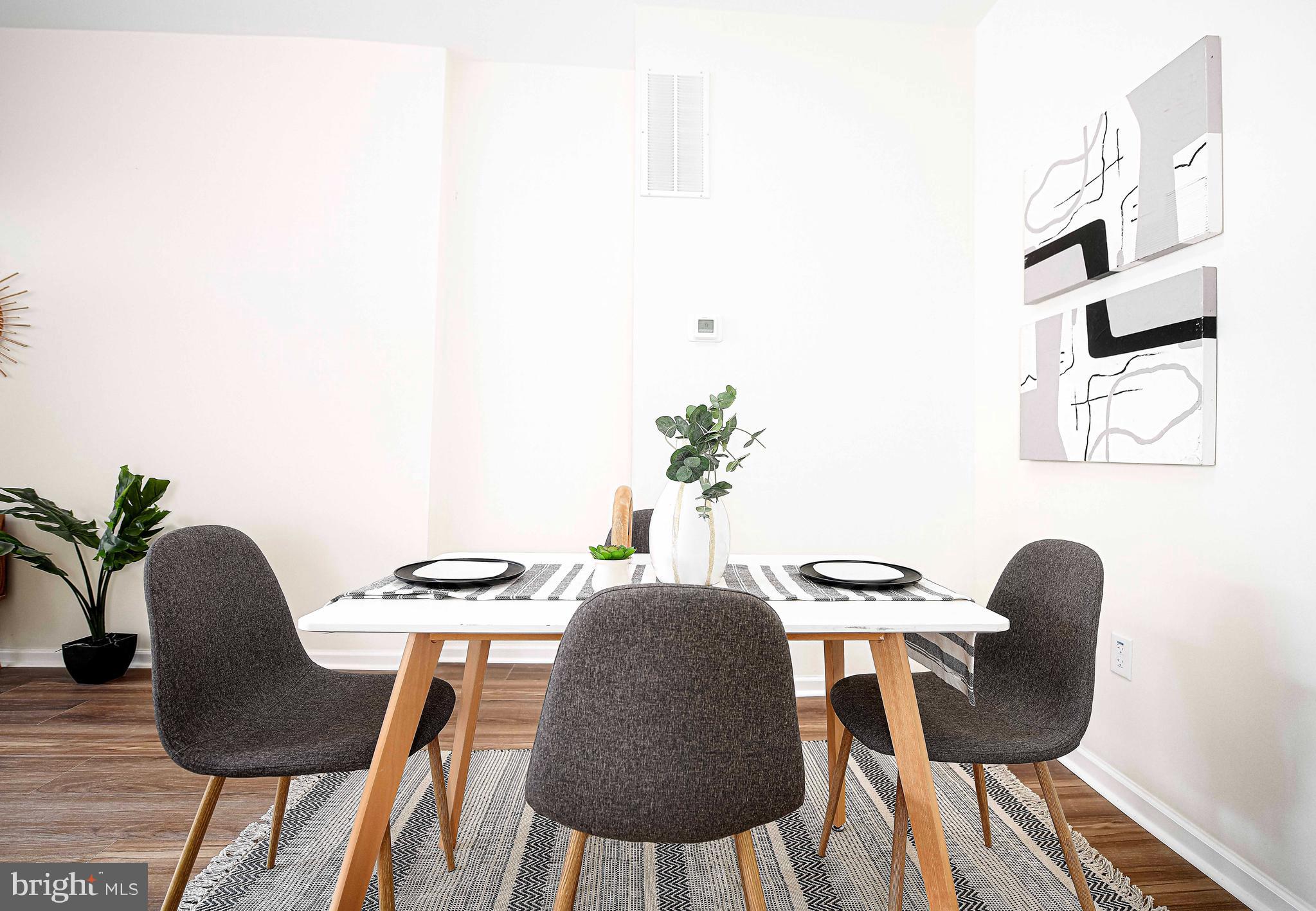 535 North Decker Avenue Baltimore, MD 21205 - Photo 8 of 24 a view of a dining room with furniture and wooden floor