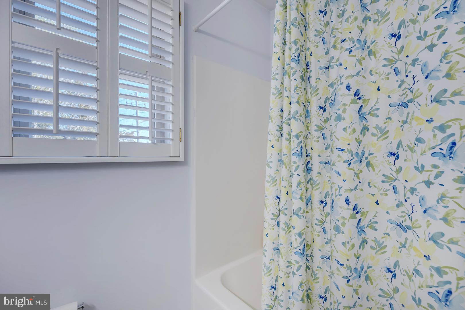 33006 Deer Trail Millville, DE 19967 - Photo 20 of 54 a bathroom with a shower curtain and a curtain