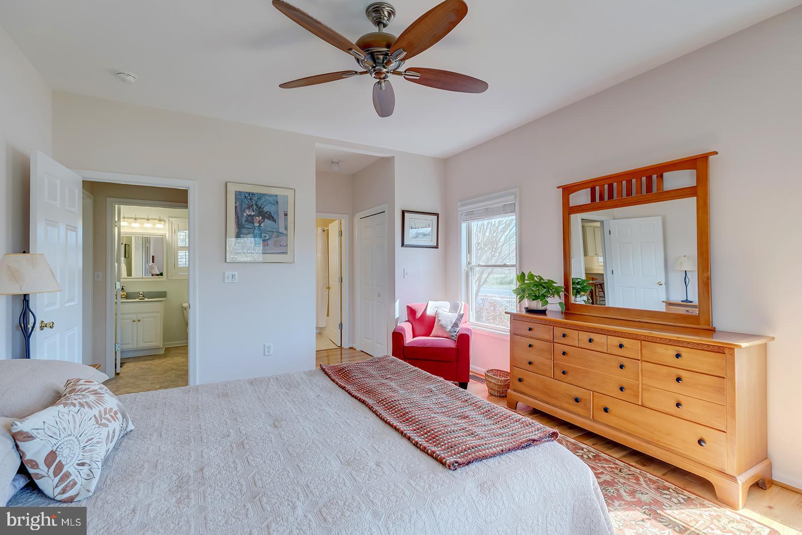 33006 Deer Trail Millville, DE 19967 - Photo 22 of 54 a bedroom with a bed and a dresser