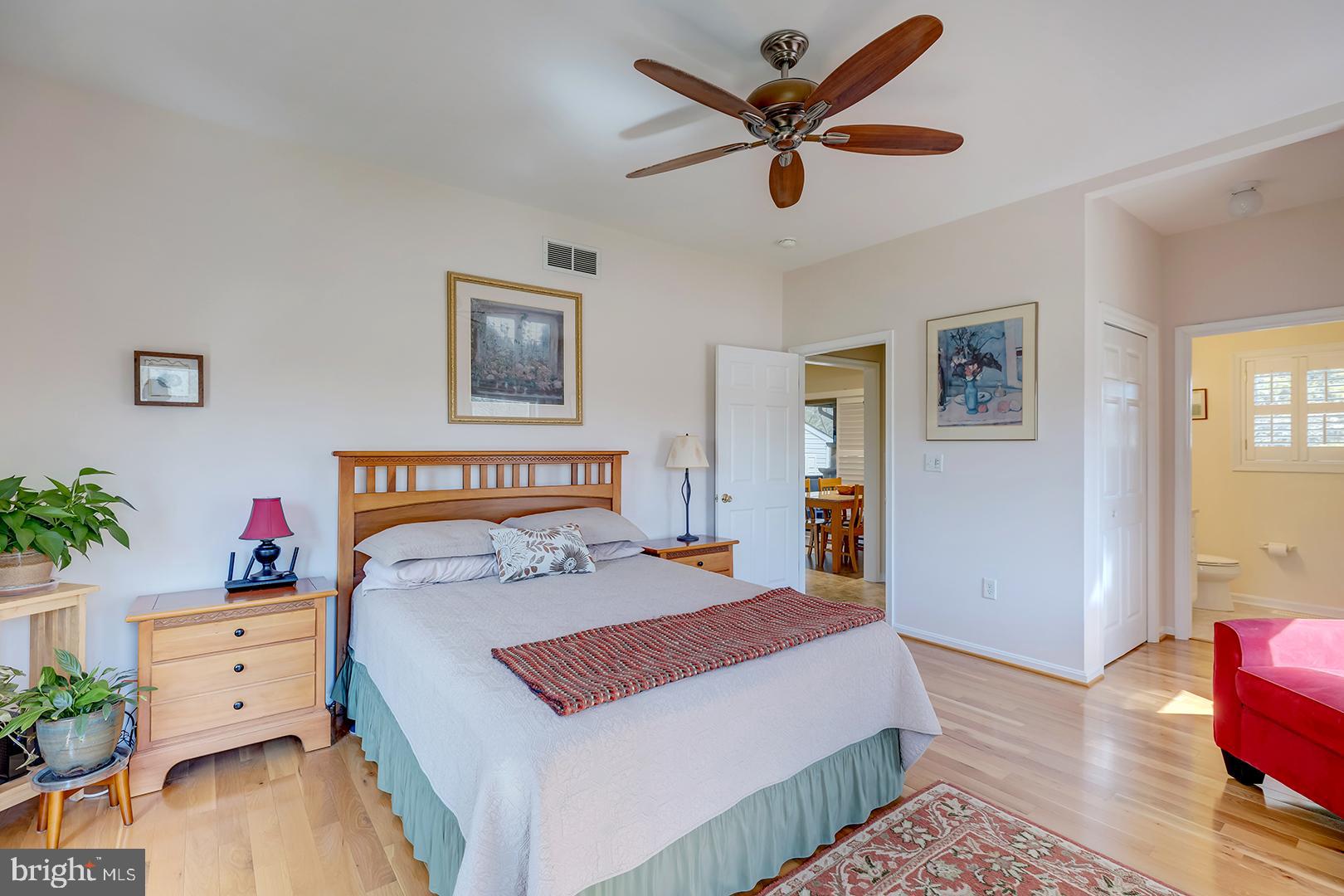 33006 Deer Trail Millville, DE 19967 - Photo 23 of 54 a bedroom with a bed and wooden floor