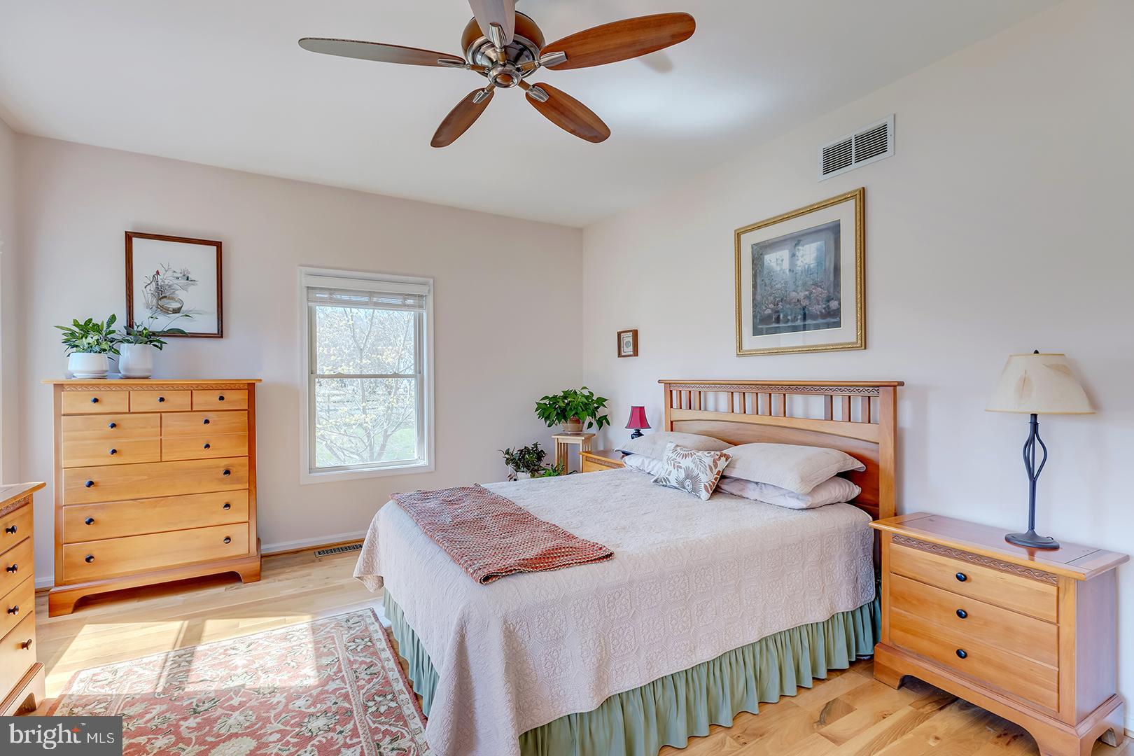 33006 Deer Trail Millville, DE 19967 - Photo 24 of 54 a bedroom with a bed and a dresser