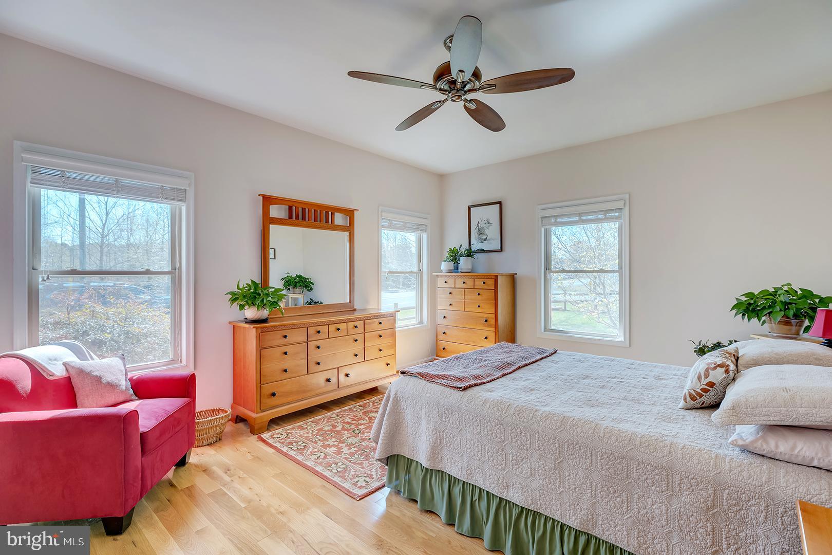 33006 Deer Trail Millville, DE 19967 - Photo 25 of 54 a bedroom with a bed a dresser and a window