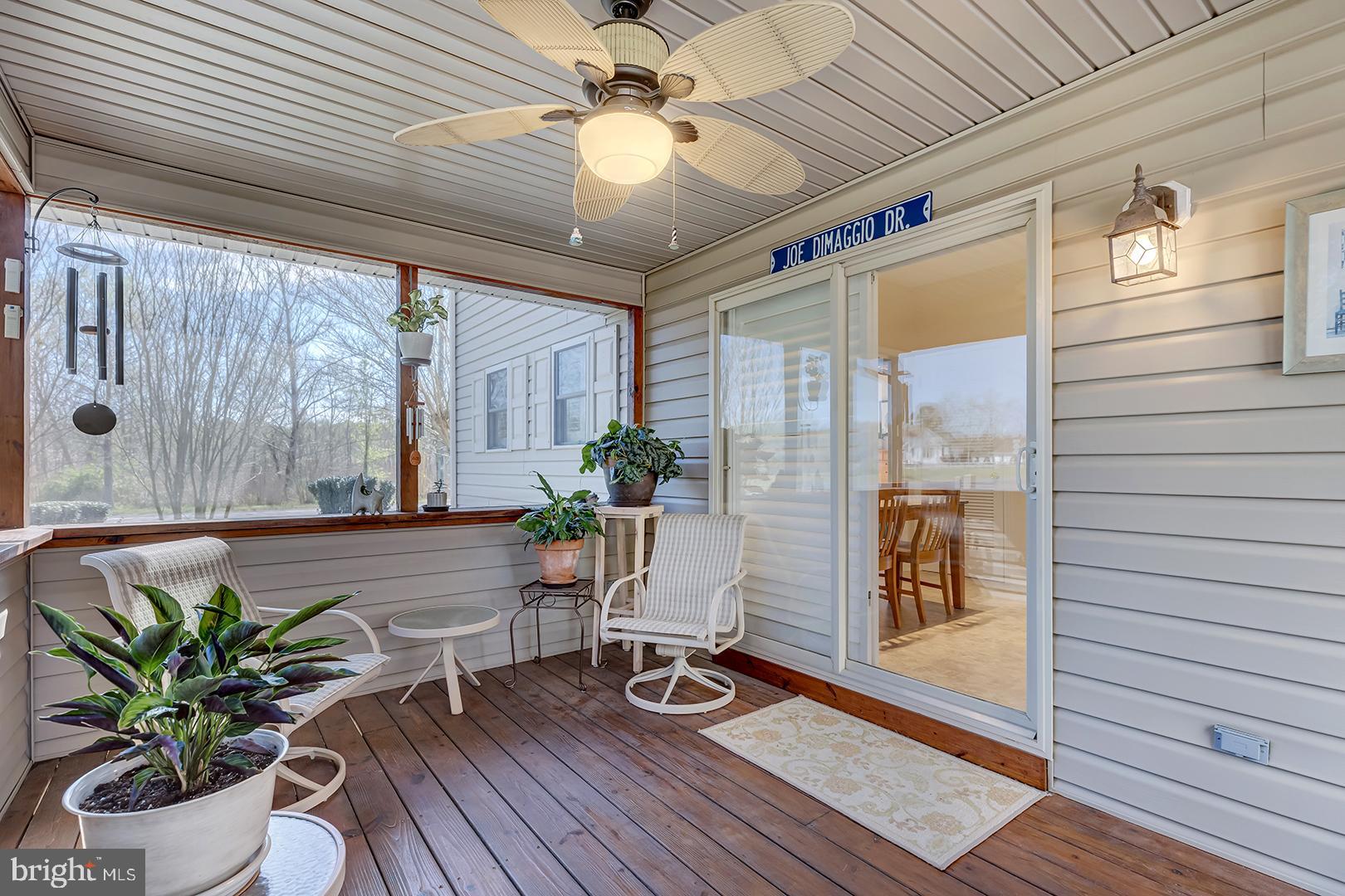 33006 Deer Trail Millville, DE 19967 - Photo 39 of 54 a living room with furniture and wooden floor