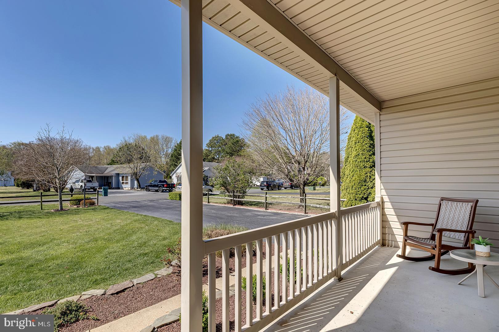 33006 Deer Trail Millville, DE 19967 - Photo 40 of 54 a view of a porch with chairs and backyard