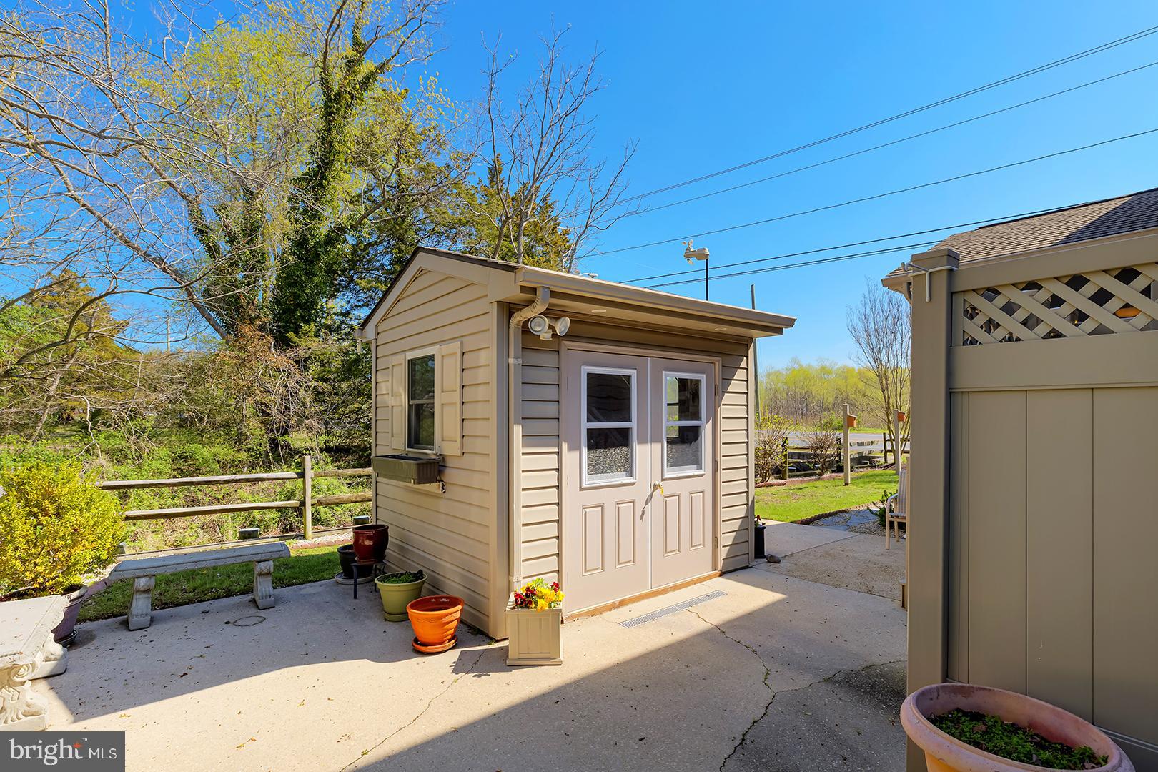 33006 Deer Trail Millville, DE 19967 - Photo 44 of 54 a front view of a house with outdoor seating