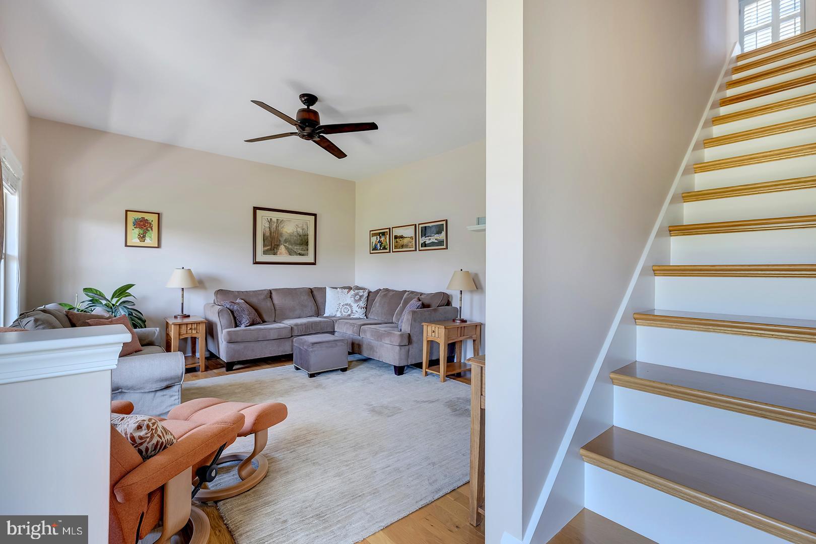 33006 Deer Trail Millville, DE 19967 - Photo 6 of 54 a living room with furniture and a ceiling fan