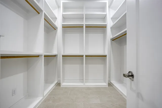 a view of an empty walk in closet