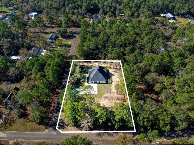 an aerial view of house with yard