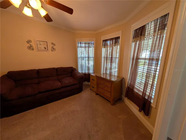 a living room with furniture and a window