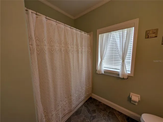 a view of a room with a window and a window