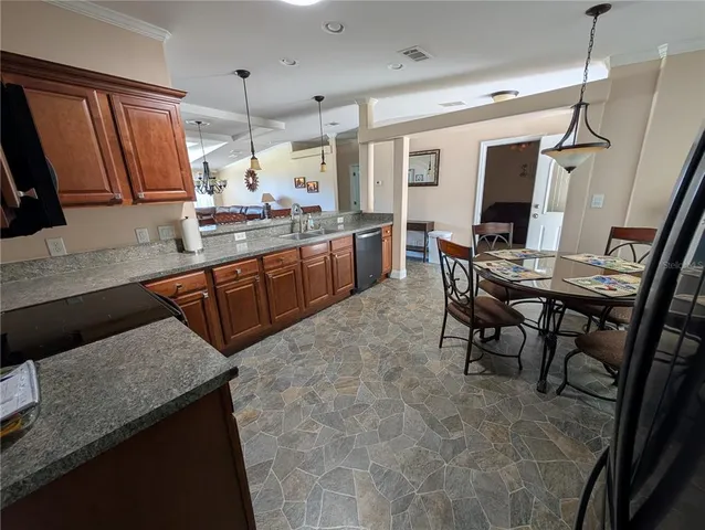 a kitchen with sink cabinets and window