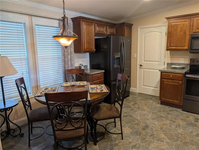 a table and chairs in a kitchen