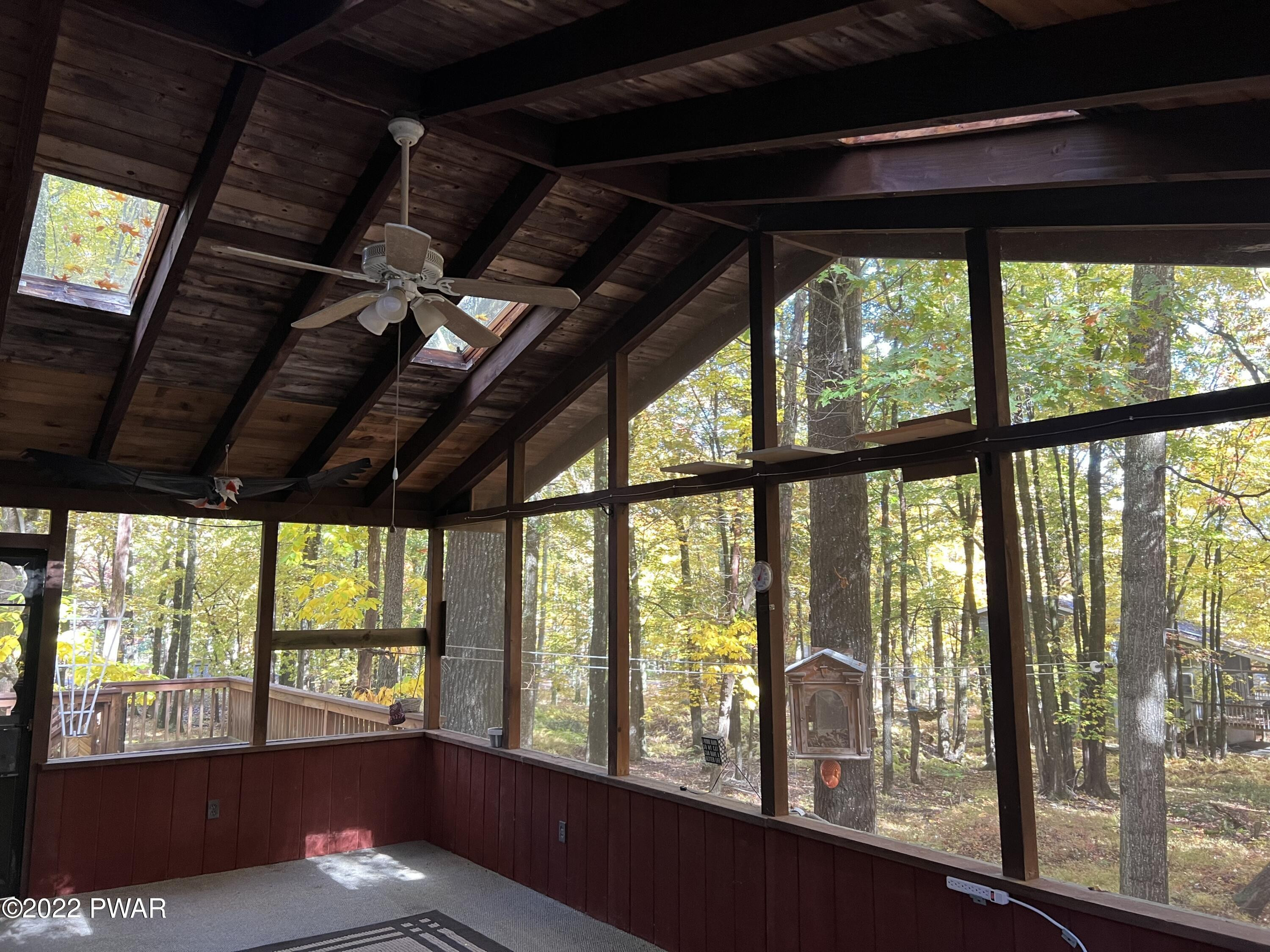 135 Rodeo Drive Hawley, PA 18428 - Photo 5 of 23 a view of an empty room with a balcony