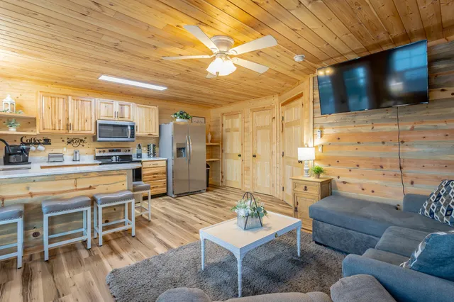 a view of a wooden deck and a big yard