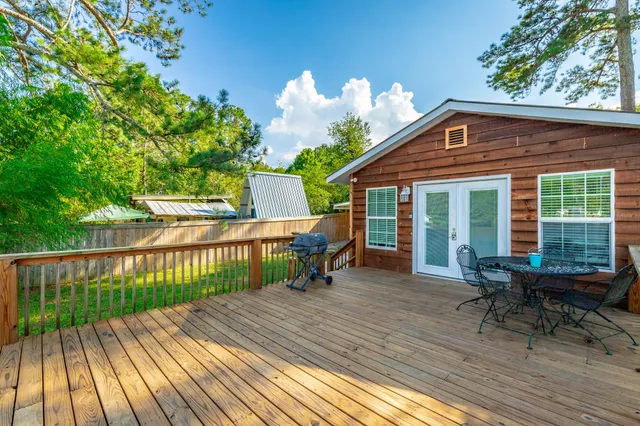 a kitchen with stainless steel appliances granite countertop a refrigerator a stove and a sink