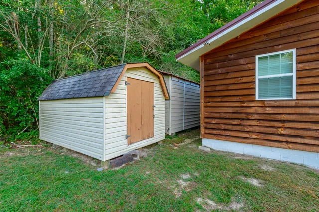 a view of a house with a backyard