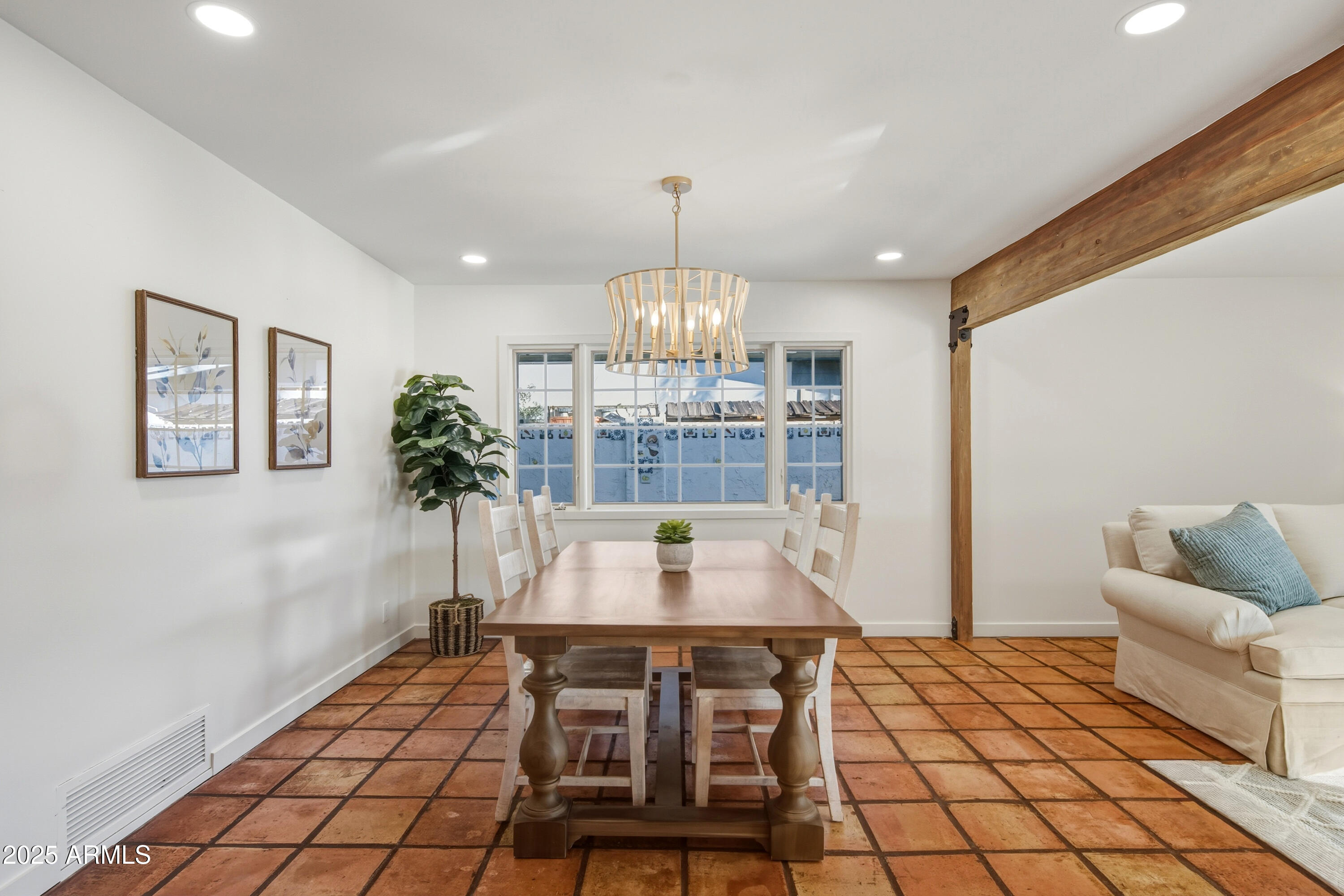 537 North Jay Street Chandler, AZ 85225 - Photo 11 of 39 a dining room with furniture and chandelier